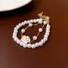 Pulsera de Perlas Camelia Goteo de Aceite Estilo Retro Francés Versátil Pulsera de Lujo Ligero Temperamento Joyería de Moda de Gama Alta Venta al Por Mayor