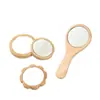 Espejo de maquillaje especial transfronterizo con mango, espejo de tocador de bambú y madera, espejo pequeño portátil de mano de alto valor para uso doméstico