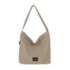 Bolso bandolera casual de lona estilo japonés para mujer 2025 Nuevo Bolso de hombro simple de gran capacidad Diseño de nicho Bolso para ir al trabajo