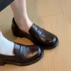 Zapatos de cuero para mujer estilo británico retro 2026 nuevo modelo mocasines slip-on con tacones gruesos, punta redonda, suela gruesa, zapatos casuales