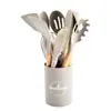 Suprimentos de cozinha transfronteiriços cabo de madeira utensílios de cozinha de silicone conjunto de 12 peças tubo de armazenamento colher de cozinha espátula panelas antiaderentes fabricantes em estoque