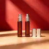 Botella de spray de fondo grueso de 5 ml para productos transfronterizos nuevos, botella de perfume redonda de color té, botella de spray pequeña mate de color té, botella de recarga de perfume de vidrio