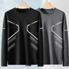 Camiseta casual masculina versátil de cor sólida para o outono 2026, gola redonda solta, manga longa, top moderno