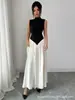 Vestido de Lujo Ligero Estilo Francés Transfronterizo Europeo y Americano 2026, Bloques de Color Blanco y Negro, Cuello Semi Alto, Sin Mangas, Ceñido a la Cintura, Vestido Largo Elegante