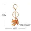 Llavero de gato lindo transfronterizo metal hueco nicho moda charm personalizado cadena para colgar en el coche teléfono llavero