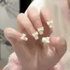 Armadura de mano sentido avanzado hecho a mano ins explosiones diamante roto mariposa uña piezas de uña al por mayor uñas portátiles
