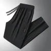 Calças masculinas para primavera e outono, calças casuais da moda com bolsos com zíper, calças esportivas jogger retas largas