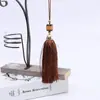 Venta al por mayor de fábrica 15 colores borla de jade hecha a mano pequeño colgante oreja textil para el hogar banderín de mesa borla cortina de oreja accesorios