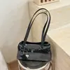Bolsa de ombro estilo garota hot retrô Shuai Mi Jia para mulheres, nova bolsa de mão para o dia a dia 2026, bolsa baguette, bolsa de ombro texturizada
