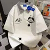 Camiseta de manga corta a cuadros tipo polo, imitación dos piezas, 100% algodón puro, inspirada en diseño, para hombres y mujeres, top casual suelto versátil de verano