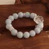Pulsera bicolor de cristal azul natural y cristal rosa con diseño de oso y rosa, una pulsera blanca de lujo ligero y estilo antiguo fresco.