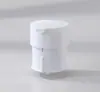 Botella redonda recargable de 100ML-30ML con base giratoria y sistema de presión por vacío para esencia, loción y productos de cuidado de la piel