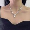 Cadena para clavícula con diseño de fantasma con costura de perla blanca y negra microincrustada de amor, diseño de nicho, dulce, fresca, a la moda, cadena para el cuello que combina con todo