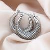 Europa y Estados Unidos arete de titanio y acero redondo hidráulico transfronterizo aretes de chapado de alta gama para mujer multiestilo en stock suministro directo de fábrica