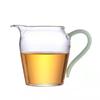 Taza de Feria de Vidrio al por Mayor con asa de color, fondo engrosado, mar de té de vidrio, dispensador de té de vidrio transparente, taza masculina con asa de jade