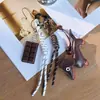 Colgante Perro Salchicha Serie Miu Colgante Bolsa Cuerda Tejida Estilo Pareja Encanto de Bolsa Llavero Lindo Senderismo Retro Ins