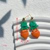 Calle popular transfronteriza. Pendientes verdes del Día de San Patricio, diseño de nicho, pendientes de temperamento de mujer de alta calidad, venta al por mayor