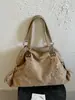 Bolso retro de nicho de gran capacidad para mujer, nuevo bolso de hombro de moda 2026 para ir al trabajo, bolso de mano de alta gama