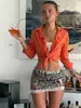 Minifalda de lentejuelas de tiro bajo con ribete de encaje en el dobladillo, adecuada para el escenario y para fiestas.
