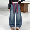 Roupas de Outono para Meninas Jeans 2026 Novo Estilo Alunos do Ensino Fundamental Crianças Maiores Personalidade Calças Largas Meninas Primavera e Outono Calças de Perna Torta