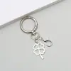 Llavero colgante retro de aleación del Árbol de la Vida con trébol de la suerte y letra, accesorio para mochila, superventas transfronterizo de Amazon