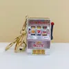 Máquina tragamonedas mini creativa jugable, agitador agitador juego de dar la vuelta, colgante de llavero, simulación de bolsa