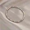 Pulsera Abierta de Bambú Retro Francesa para Mujer Acero de Titanio Sin Color Lujo Ligero Diseño de Nicho Pulsera Anillo Superior Avanzada