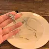 Alas de Espíritu de Hada Borla Moda Todo Fósforo Clip para Oreja Clip para Oreja de Mujer sin Agujeros en las Orejas Pendientes Colgantes de Oreja de Alta Gama Coreanos