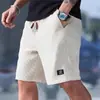 Pantalones cortos de punto gofrado para hombre, de verano, atléticos y casuales, de importación europea y americana, un artículo popular y de los más vendidos