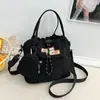 Bolso bandolera de lona nuevo estilo coreano, con un diseño fresco y moderno, perfecto para estudiantes, y un bolso de hombro lindo y versátil que se puede combinar con varios atuendos