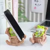 Creativo Lindo Relleno de Escritorio de Oficina Rana Soporte para Teléfono Móvil Artesanía de Resina Adornos Decorativos Regalo de Cumpleaños