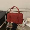 Bolso de mano de moda para viajeros 2025 Nuevo estilo coreano Simple Elegante Axila Portátil Forro polar Bolso cuadrado pequeño Bandolera