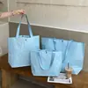 Bolsa tejida de alta gama, color liso, con cierre de broche oculto para tiendas de ropa, empaque de ropa para mujer, empaque de regalo al por mayor