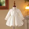Vestido de manga larga para niña de un año para una fiesta de cumpleaños en invierno 2026, vestido de princesa de satén blanco, dropshipping transfronterizo