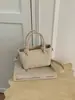 Bolso tote pequeño surtido super caliente transfronterizo para mujer 2026 nuevo nicho sentido de alta gama para ir al trabajo bolso cruzado tipo cubo
