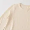Venta Rápida Transfronterizo Tong Artículo Caliente 2026 Primavera Nuevo Ropa de Mujer Manga Larga Cuello Redondo Asimétrico Adorno de Encaje Top 8779630