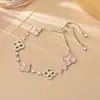 Pulsera de Trébol de Cuatro Hojas Chapada en Cobre Oro Real Más Vendida Estilo Dulce Fresco Femenino Moda de Gama Alta Ajustable Pulsera de la Suerte Moderna