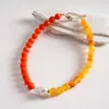 Collar asimétrico de bloqueo de color acrílico de perlas de dopamina europeo y americano, cadena para la clavícula personalizada de nicho transfronterizo de alta gama para mujeres