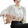 Tiro real 2025 camisa de satén color albaricoque francés diseño de primavera para mujer top ajustado de temperamento chic