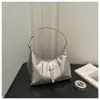 Bolsa de Axila de Nicho para Mulheres 2026 Nova Primavera High-End Luxo Leve Versátil para o Dia a Dia e Deslocamento Bolsa de Ombro Único Transversal