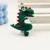 Chaveiro Pingente de Figurine de Dinossauro Desenho Animado em Borracha Macia PVC Ornamento Acessório Clássico Dinossauro Tiranossauro Rex