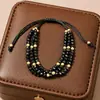 Pulsera Apilada Bohemia de Tres Capas de Venta Caliente Europea y Americana Diseño de Nicho Simple Versátil Pulsera de Abalorios Hecha a Mano