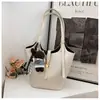 Bolsa de balde grande da moda estilo coreano, nova e transfronteiriça para 2026, para mulheres, com um visual sofisticado, adequada para o trabalho e o trajeto, e pode ser usada como bolsa de ombro pai-filho.