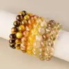 Pulseira de Contas Raio de Olho de Tigre Natural Cristal do Mar Leste Brasil Homens Mulheres Pulseira de Atração de Riqueza Cristal Amarelo Quartzo Rutilado Contas Soltas Atacado