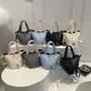 Bolso tipo cubo texturizado estilo western 2026 versión coreana verano nueva moda simple casual versátil bolso de hombro cruzado