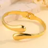 Pulsera de titanio con tendencia de moda europea y americana transfronteriza, gota de agua, línea aerodinámica, textura de metal exagerada, pulsera suave de abrazo, joyería