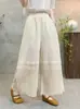 Estilo nuevo de verano estilo chica Mori artístico cintura elástica color liso diseño de retazos huecos pantalones rectos holgados versátiles al por mayor