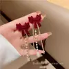 Pendientes de Borlas con Lazo Rojo 2026 Nuevo Estilo Caliente Lujo Ligero Gama Alta Pendientes de Año Nuevo Accesorios de Oreja Únicos de Nicho