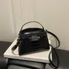 Bolso cruzado nuevo de color liso con hebilla tipo Kelly, bolso pequeño cuadrado, bolso de mano moderno y a la moda, con sentido de temperamento, de un solo hombro, bolso para mujer