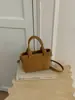 Bolso tipo cubo de tejido de alta gama para mujer, nuevo y elegante, estilo verano chic, de un solo hombro y cruzado